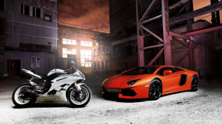 Motorcycles parking lot night building - a building in the background free wallpaper for desktop
