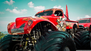 Red truck monster wheels field - a red truck free wallpaper for desktop
