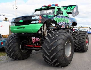 Monster truck large tire road - a monster truck free wallpaper