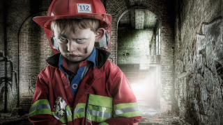 Boy fireman helmet graffiti tunnel - a dark tunnel free wallpaper