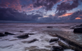 Rocky beach cloudy sky dusk - a rocky beach free wallpaper
