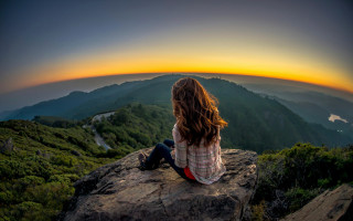 Woman sitting rock sunset valley - a view of a valley free wallpaper for desktop