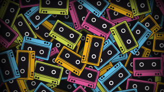 Colorful cassettes scattered black background - scattered free wallpaper
