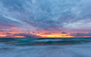 Sunset ocean wave clouds boat - a sunset over the ocean free wallpaper