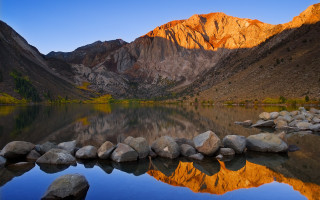 Mountain range reflection lake rocks 3 - the foreground and a mountain range in the background free wallpaper for desktop