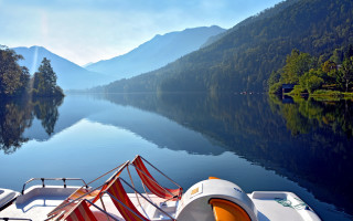 Lake mountains trees boat sunbeam - a boat free wallpaper for desktop