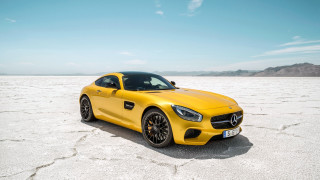 Yellow sports car desert sky 3 - a desert area free wallpaper