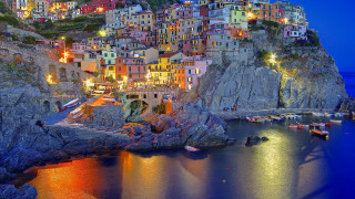 Cliff town night boats cityscape - a town free wallpaper