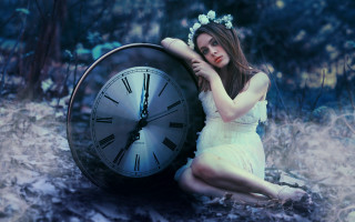 Woman forest clock flower sitting - her hand and a flower free wallpaper