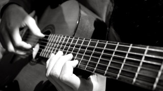 Person playing guitar hands strings 3 - photo of a person holding free wallpaper