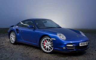 Blue sports car foggy evening - a dark sky free wallpaper