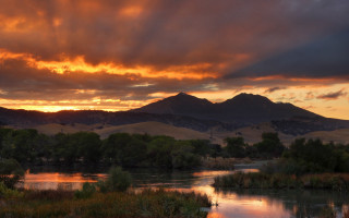 Sunset river mountains trees water - a sunset over a river free wallpaper