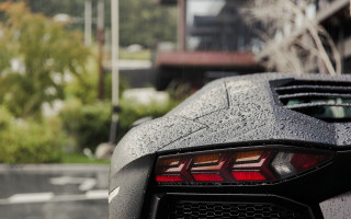 Black sports car rain building - a black sports car free wallpaper