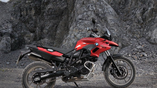Red motorcycle cliff forest spotcolor - a red motorcycle free wallpaper