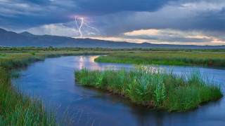 River lightning mountains grass sky - a lightning bolt in the sky above free wallpaper