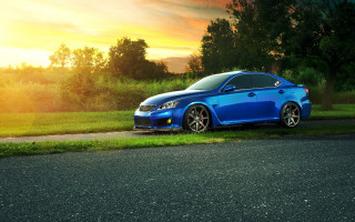 Blue car parked road grassy - rim free wallpaper