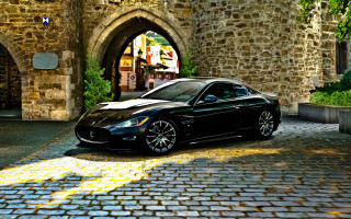 Black sports car stone building 2 - a stone building free wallpaper