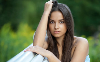 Woman leaning on rail blurry - free forest wallpaper