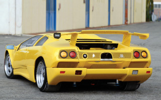 Yellow sports car parking lot 9 - a parking lot next free wallpaper