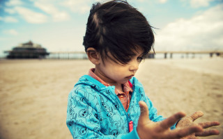 Little girl beach ocean hands - a sandy beach next free wallpaper for desktop