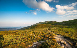 Grassy hill trail clouds blue - a trail free wallpaper