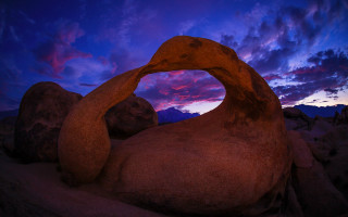 Rock formation purple sky sunset - a purple sky in the background free wallpaper for desktop