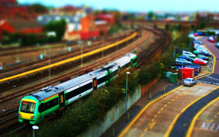 Train green field tilt shift - a lush green field free wallpaper