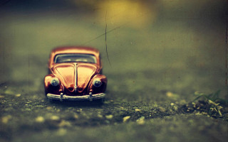 Toy car grass rocks tilt - a toy car free wallpaper