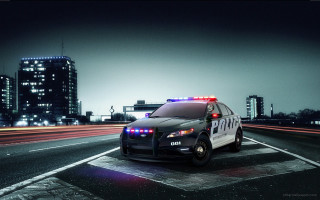 Police car night city lights - a police car free wallpaper