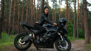 Woman motorcycle woods helmet black - full body pose free wallpaper