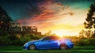 Blue car grass field sunset - a blue car free wallpaper