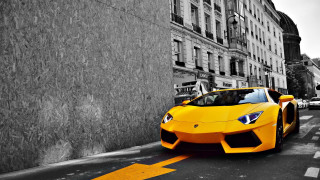 Yellow sports car street building - the side of a street next free wallpaper