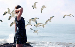 Woman rock ocean seagulls wind - a rock near the ocean free wallpaper