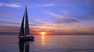 Sailboat ocean sunset dusk beach - the distance behind free wallpaper