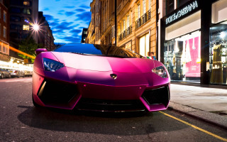 Pink sports car night cityscape - the side of the road in front free wallpaper for desktop
