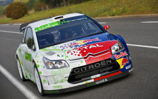 Colorful car driving road hill - a hill in the background and trees free wallpaper