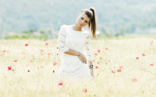 Woman flower field pony tail - a woman in a field of flowers free wallpaper