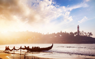 Beach sunset lighthouse boat sky - a boat free wallpaper for desktop