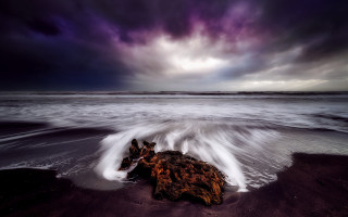 Rock beach storm purple sky - a purple sky above free wallpaper for desktop