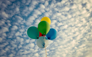 Balloons cloudy sky blue background - free happy birthday wallpaper