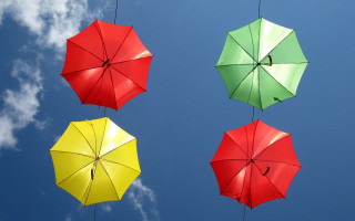 Three umbrellas clouds sky colorful - triadic free wallpaper for desktop