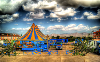 Circus tent trees cloudy sky - a cloudy sky free wallpaper