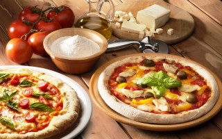 Food table pizzas cheese tomatoes - professional food photography free wallpaper