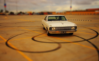 White car parking lot sunset 4 - a yellow line free wallpaper