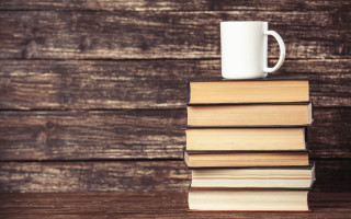 Stack books mug wooden table - a wooden table next free wallpaper