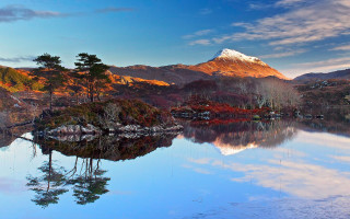 Mountain lake trees snow sunset - a lake in the foreground and a snow free wallpaper