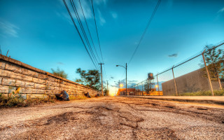 Dirt road fence building sky - a dirt road free wallpaper