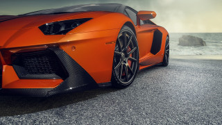 Orange sports car ocean cloudy - nice looking orange sports car free wallpaper