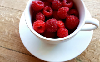 White bowl raspberries wooden table - a white bowl free wallpaper for desktop