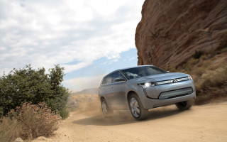 Silver car dirt road cliff - a silver car free wallpaper